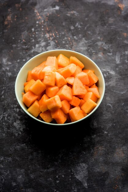 Cantaloupe or muskmelon or kharbuja cut into pieces, served in a bowl. selective focus