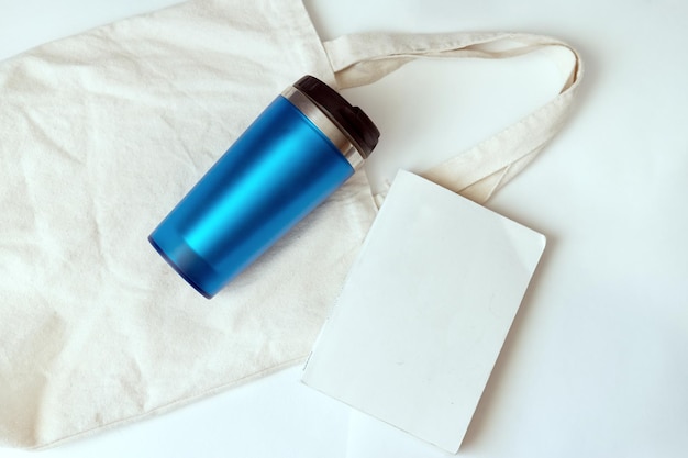 Canvas bag blue thermos and book Set for walking in the park Beach set Vacation preparationEco style