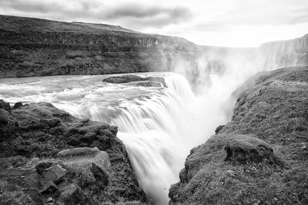 Canyon beauty Waterfall located in canyon river Iceland River rapid waterfall Water beautiful stream flow Nature landscape Iceland tourist destinations concept Waterfall in Iceland Wet air