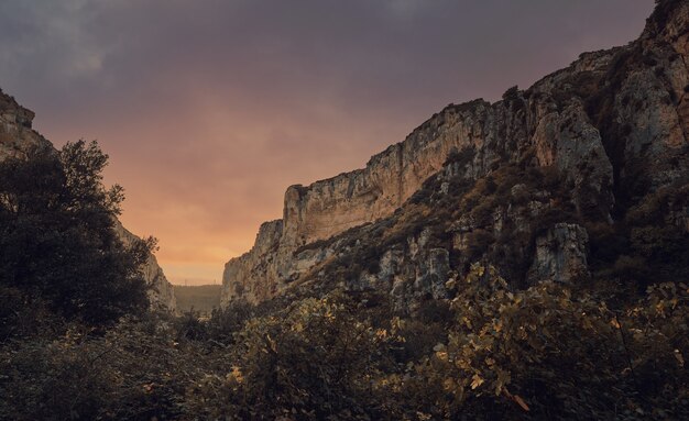 Canyon crossed by a river at sunset