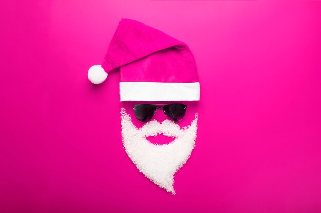 Cap, Santa Claus with black glasses and a beard of snow