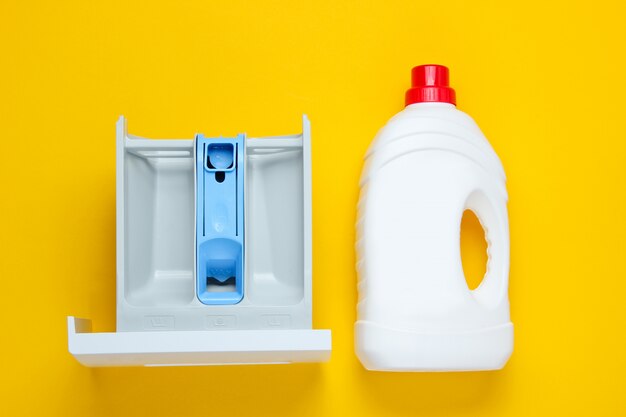 Capacity of washing machine for powder, a bottle of washing gel. Top view, flat lay