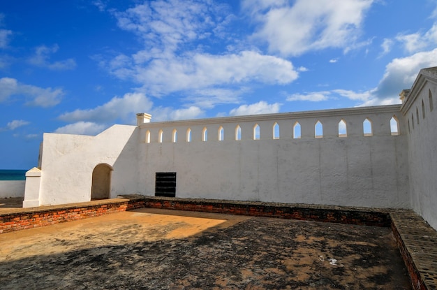 Photo cape coast castle is a fortification in ghana built by swedish traders for trade in timber and gold later the structure was used in the transatlantic slave trade