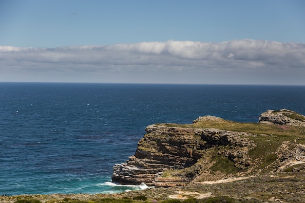 Cape of Good Hope, with a blue sky and some clouds.