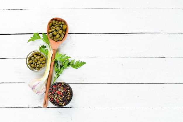 Capers Marinated capers in a bowl. Top view. free space for your text.