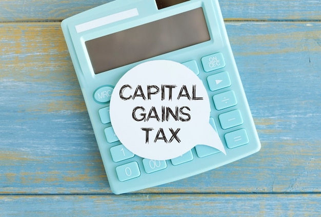 Capital gains tax-text label in the form of a document\
registrar planning folder. mandatory gratuitous payment is\
established by law by the state government.