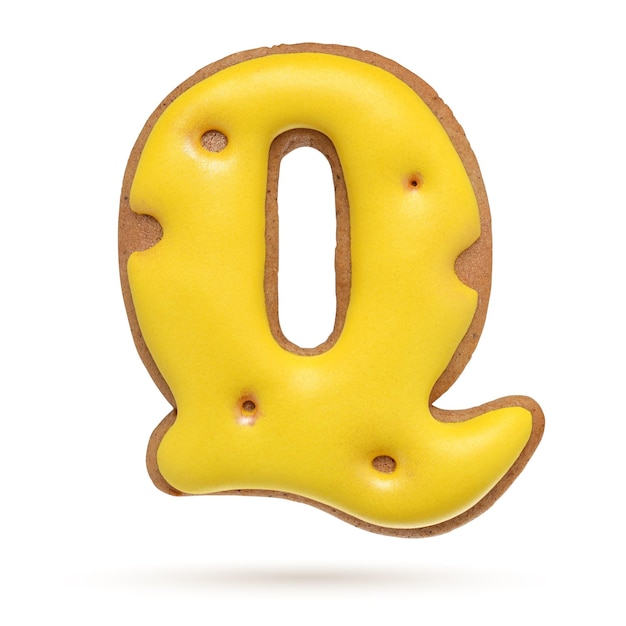 Capital letter Q yellow homemade gingerbread biscuit isolated on white background