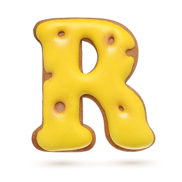 Capital letter R yellow homemade gingerbread biscuit isolated on white background