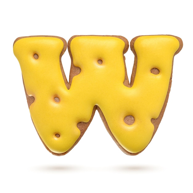 capital letter w yellow homemade gingerbread biscuit isolated on white background