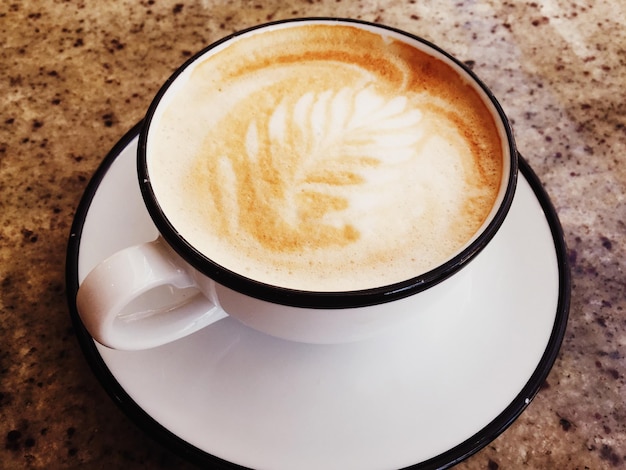 Photo cappuccino for breakfast in cafeteria coffee cup on table in parisian cafe