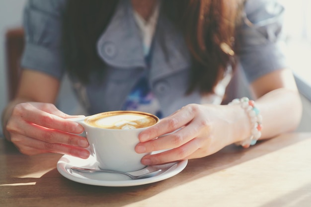 Cappuccino coffee break on wood background