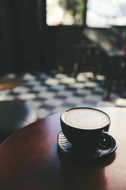 Cappuccino coffee break on wood background