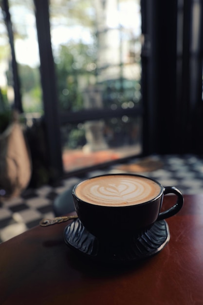 Cappuccino coffee break on wood background