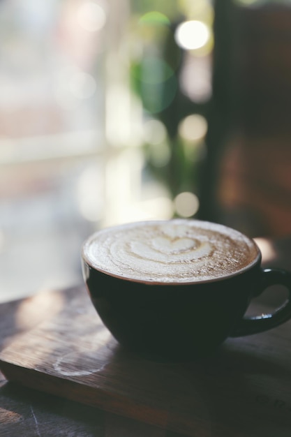 Cappuccino coffee break on wood background