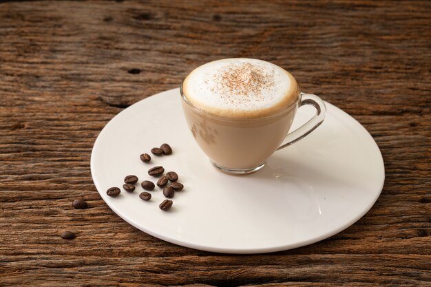 Photo cappuccino coffee clear cup on wood background  for cafe coffee shop menu