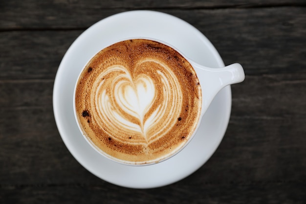 Cappuccino coffee cup on wood table