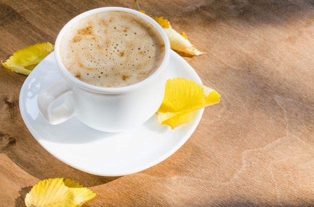 Cappuccino or coffee latte. Autumn concept.