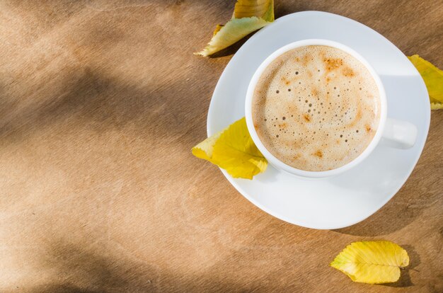 Cappuccino or coffee latte. Autumn concept.