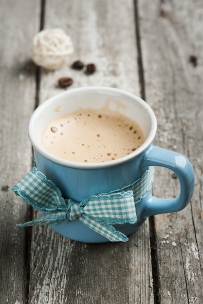 Cappuccino mug on wooden table