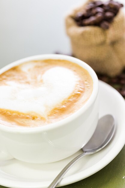 Cappuccino with heart design on foam.