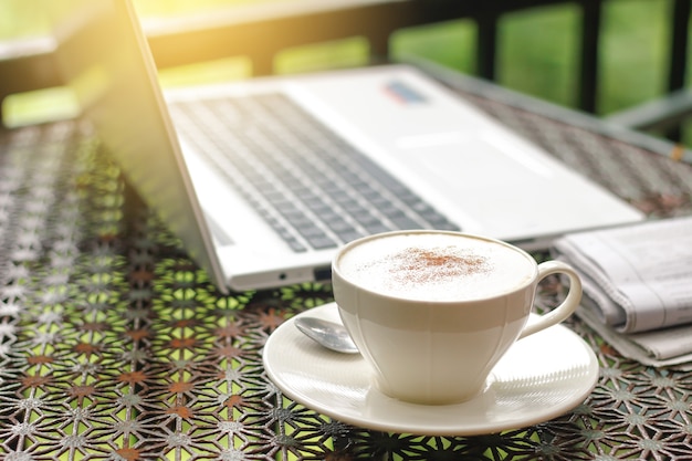 Cappuccino with newspaper