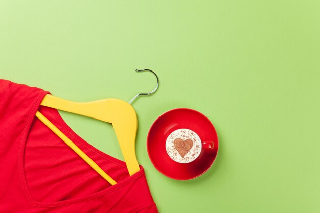 Cappuccino and yellow hanger with red dress