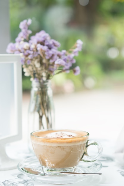 Cappuccinu coffee in clear cup on table cafe