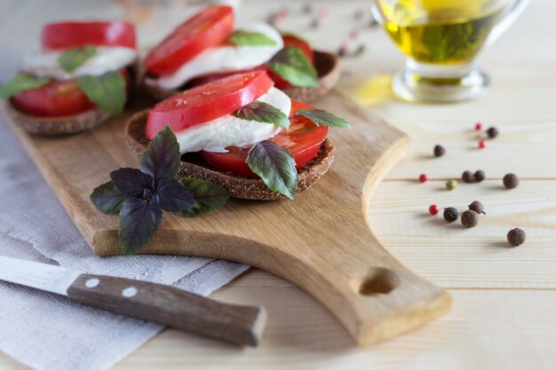 Caprese on bread slices with olive oil