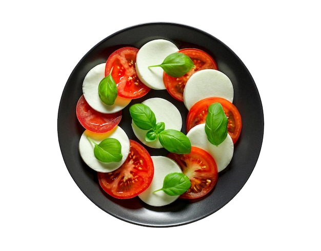 Итальянская закуска Капрезе на темно-серой тарелке на белом фоне с вырезкой