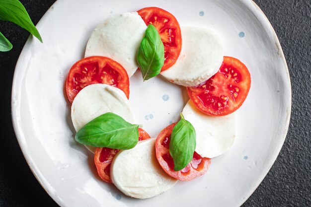 caprese salad mozzarella cheese tomato basil leaf italian snack copy space food background rustic