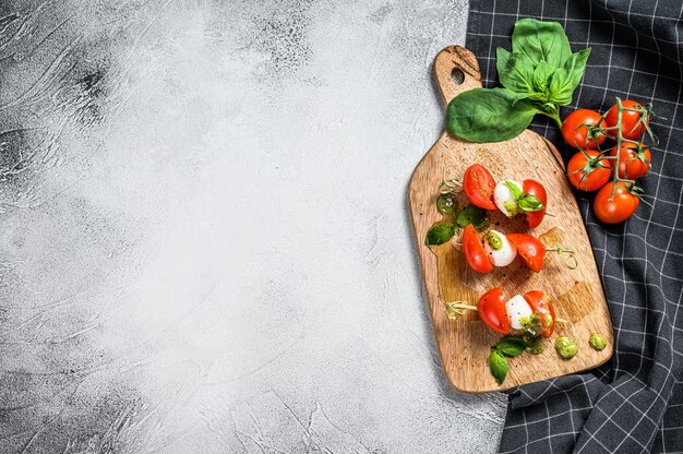 Caprese salad on skewer Tomato pesto and mozzarella Canapes