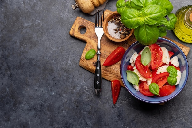 Caprese salad with ripe tomatoes mozzarella cheese and garden basil