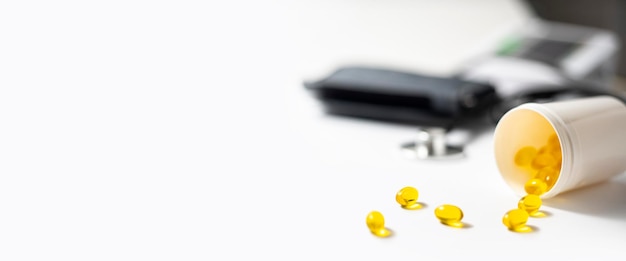 Capsule pills stethoscope on a white background Banner