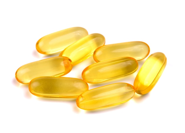 Capsules from fish oil on white