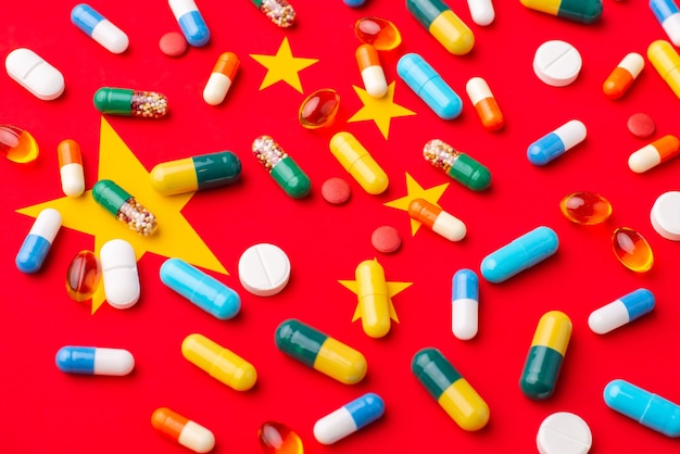 Capsules and tablets on flag of china