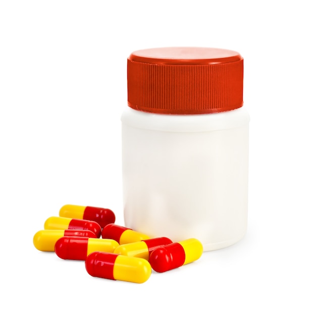 Capsules with jar with red cap isolated