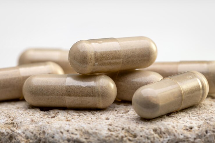 Capsules with vegetable food additives on a porous surface Homeopathy healthy eating