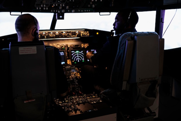 Captain and pilot flying airplane with engine lever and power\
switch on dashboard command, using buttons on control panel\
navigation to fly aircraft jet, professional aviation service.