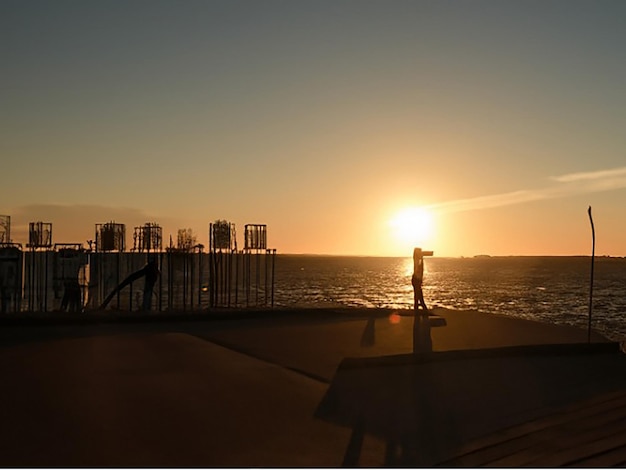 Capture the moment when the sun dips below the horizon casting long shadows