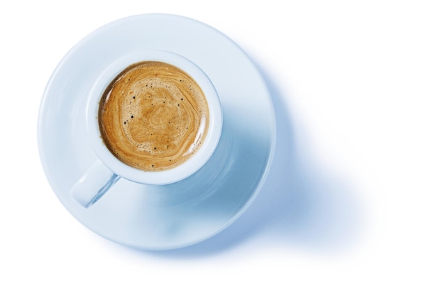 Capuchino in small coffee cup isoalted on white background