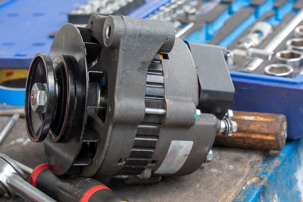 Car alternator repaired on the workbench