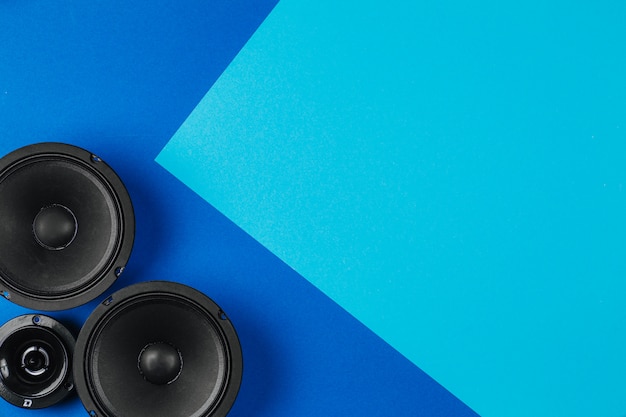 Car audio, car speakers, on a blue table