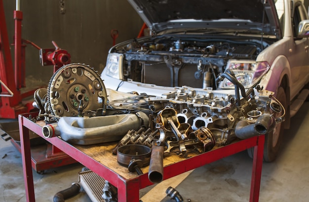 Car in automobile repair service center with soft-focus and over light in the background