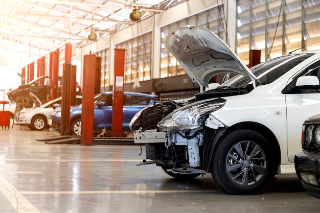 Car in automobile repair service center with soft-focus and over light in the background