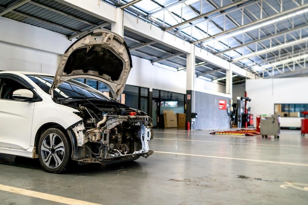 Car in automobile repair service center with softfocus and over light in the background