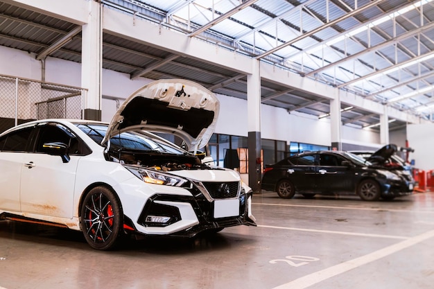 Car in automobile repair service center with softfocus and over light in the background