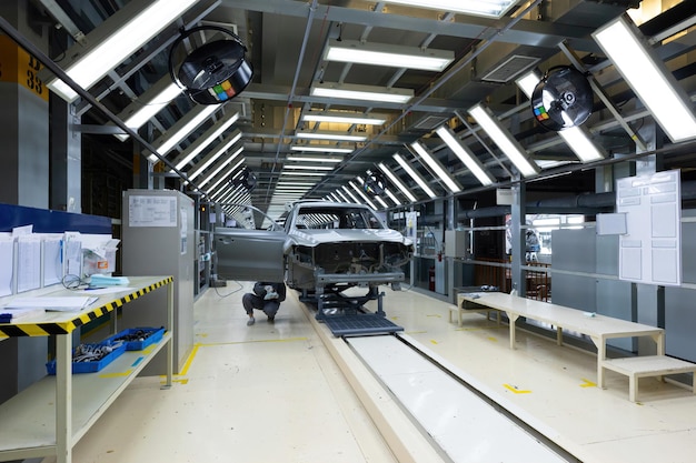 Car bodies are on assembly line factory for production of cars modern automotive industry