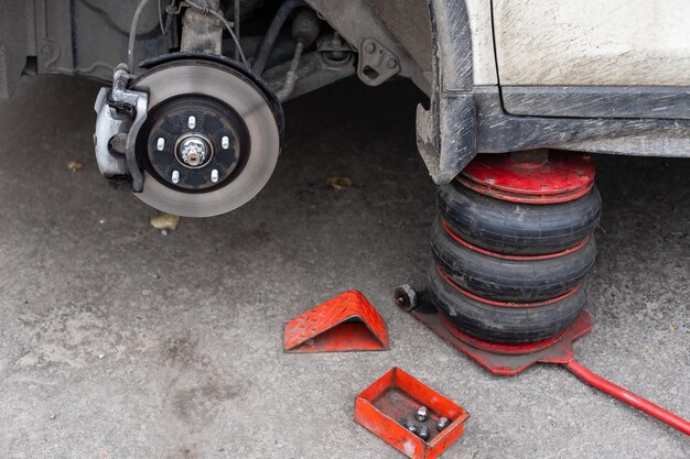 Car brake part at garage,car brake disc without wheels\
closeup