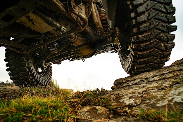 car brakes with absorbers car tire extreme off road tour in a forest water splash in offroad racing ...