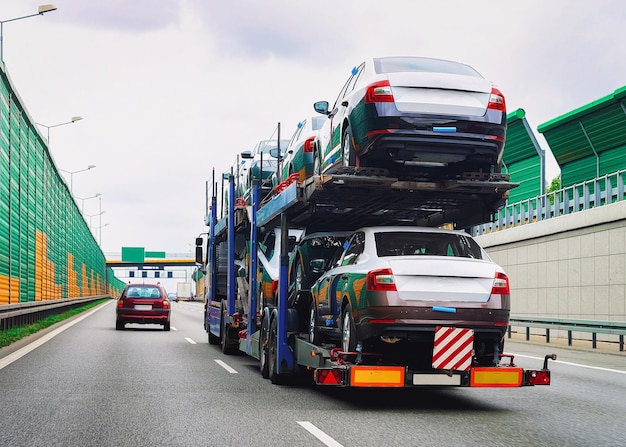 Car carrier truck on the asphalt highway in Poland. Truck transporter